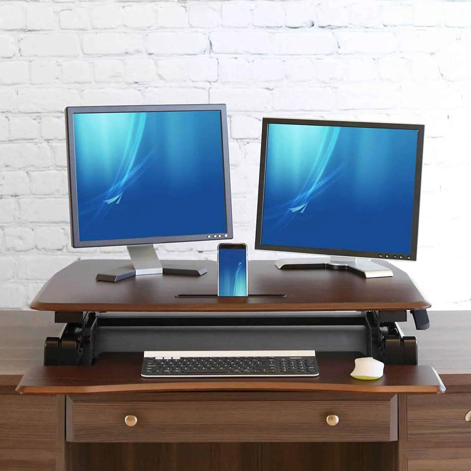 Two screens can fit on this desk converter. 