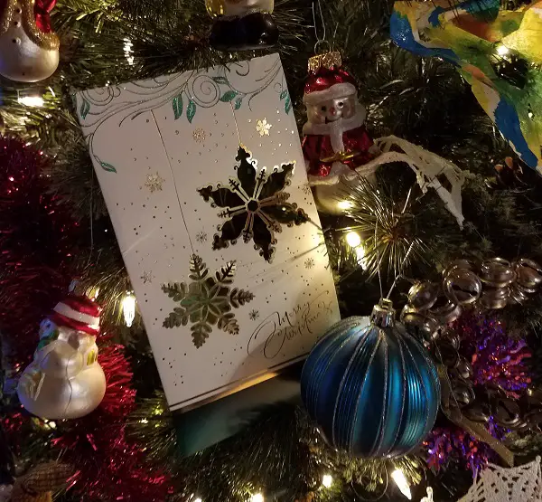 Christmas card in a decorated tree. 